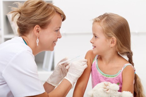 Brave little girl receiving injection