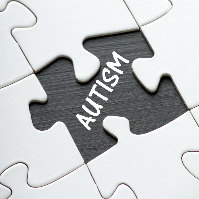 The word Autism revealed by a missing jigsaw puzzle piece