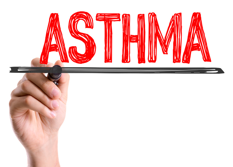 Hand with marker writing the word Asthma